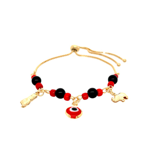 This Red and Black Evil Eye bracelet is meticulously crafted with an adjustable 14k gold-filled chain, adorned with striking black and red beads. It highlights a central Evil Eye charm, complemented by charming Figa hand and elephant gold charms, combining elegance with protective symbolism.